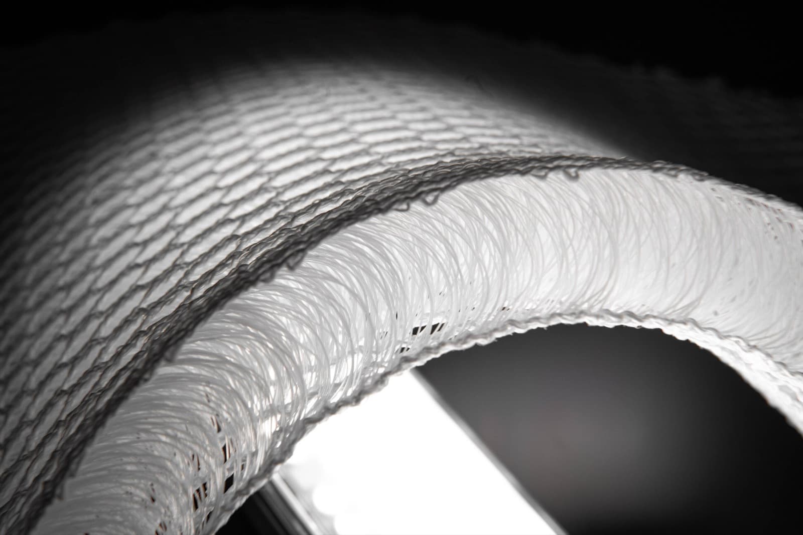 Macro photograph of the 3D mesh: monofilament pile yarns holding the two cover layers apart